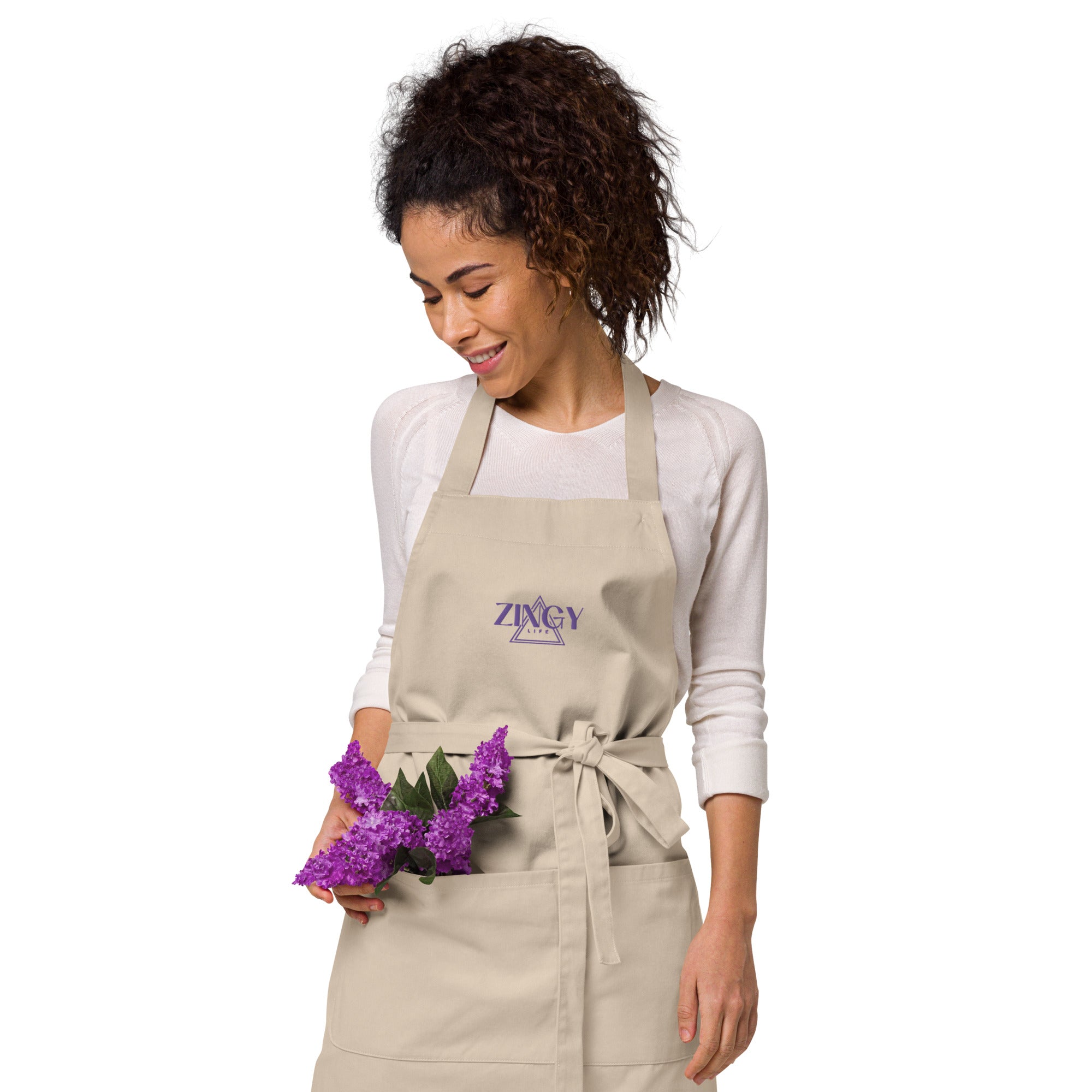 Person wearing organic cotton apron while cooking - eco-friendly kitchen wear for sustainable cooking and baking