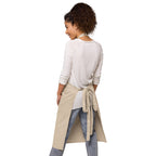 Flat lay view of organic cotton apron displaying adjustable straps and quality craftsmanship by Zingy Life
