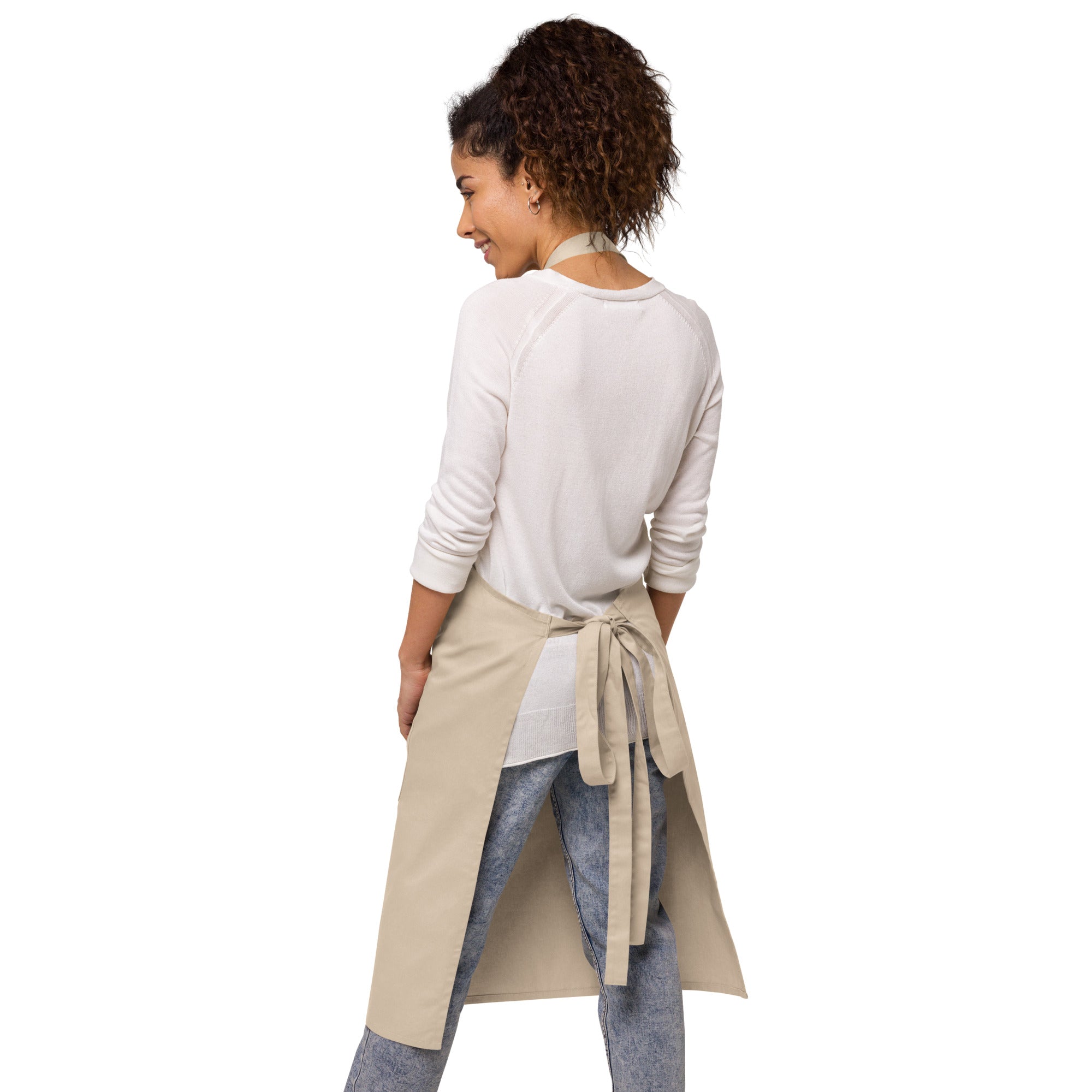 Flat lay view of organic cotton apron displaying adjustable straps and quality craftsmanship by Zingy Life