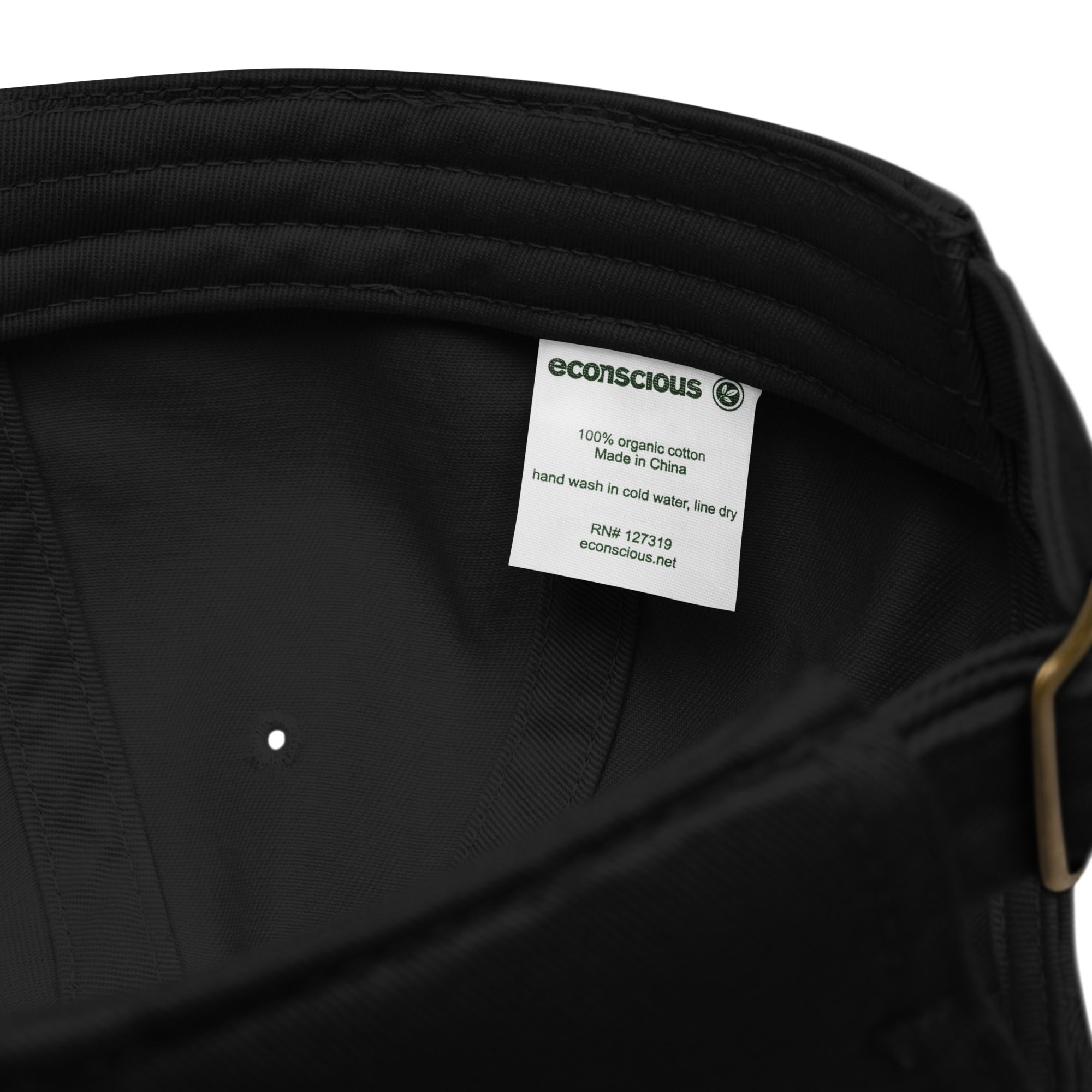Close-up of organic dad hat fabric texture showing 100% organic cotton 3/1 twill construction
