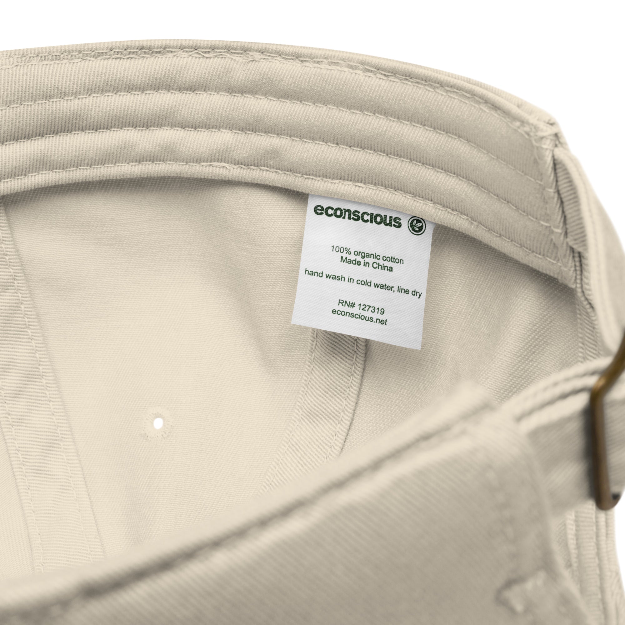 Close-up of organic dad hat fabric texture showing 100% organic cotton 3/1 twill construction