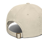 Back view of organic cotton dad hat with adjustable self-fabric closure and brass slider